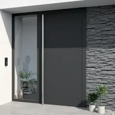 Nowoczesne drzwi zewnętrzne z przeszkleniem i kamienną okładziną. Idealne, by obrobić drzwi zewnętrzne w minimalistycznym stylu.