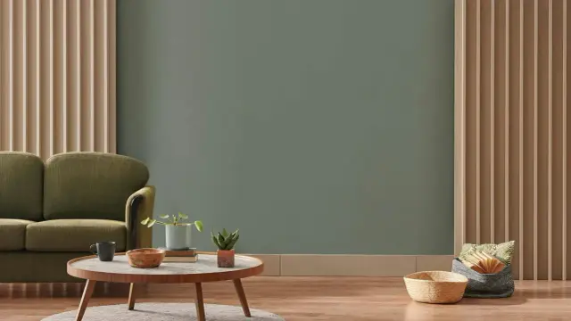 Zieleń na ścianie, idealna do salonu. Zastanawiasz się, jaka farba do ścian nada wnętrzu spokój i elegancję?